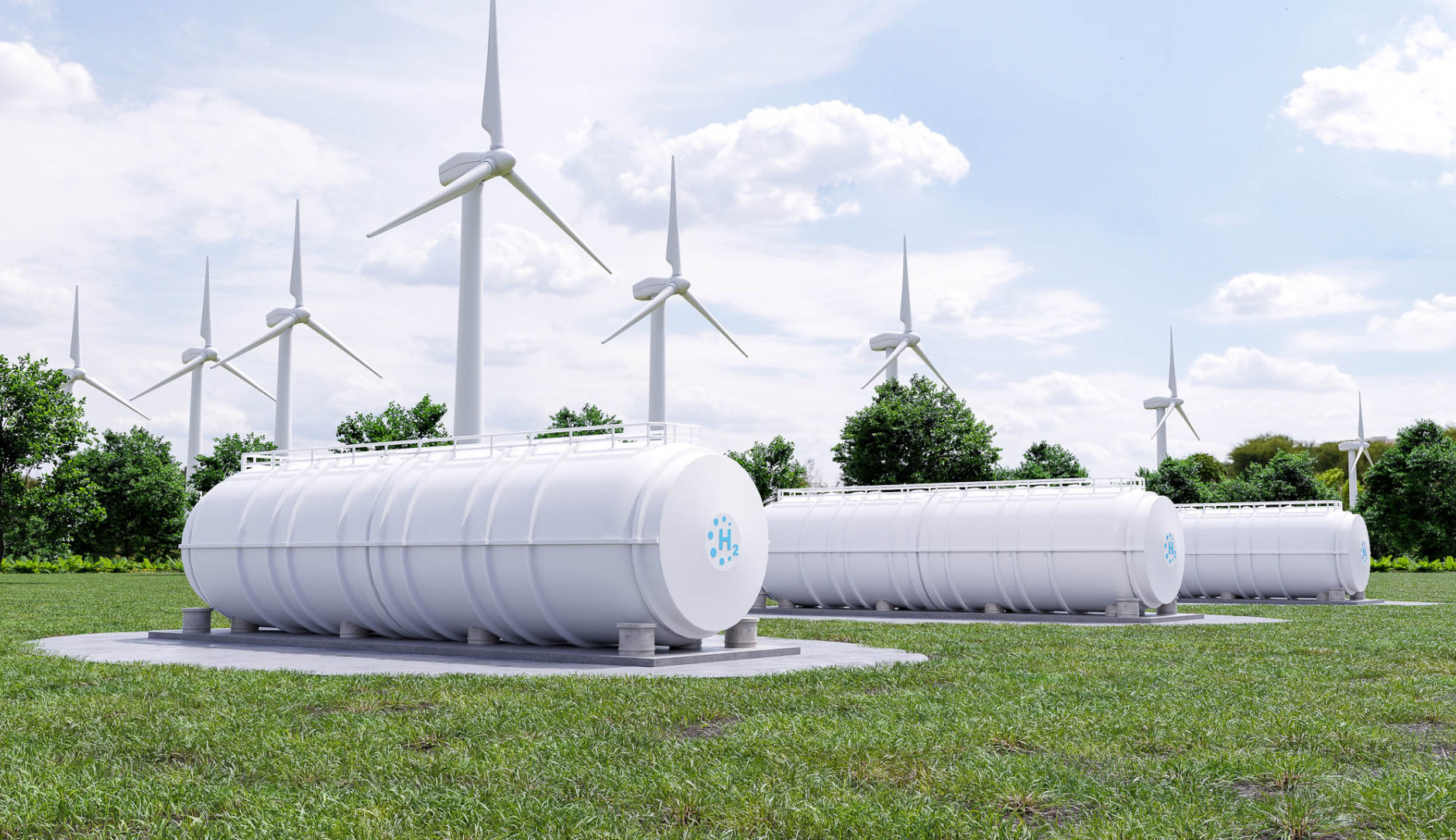 Waterstof tankers met windmolens op de achtergrond