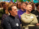 Laurens Dassen zit in het publiek tijdens het congres